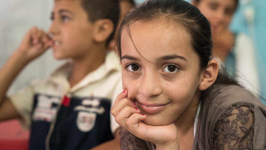Faten*, 10 years old, during a Body Map exercise in a child friendly space run by Save the Children in Tripoli, Lebanon. *Name has been changed.